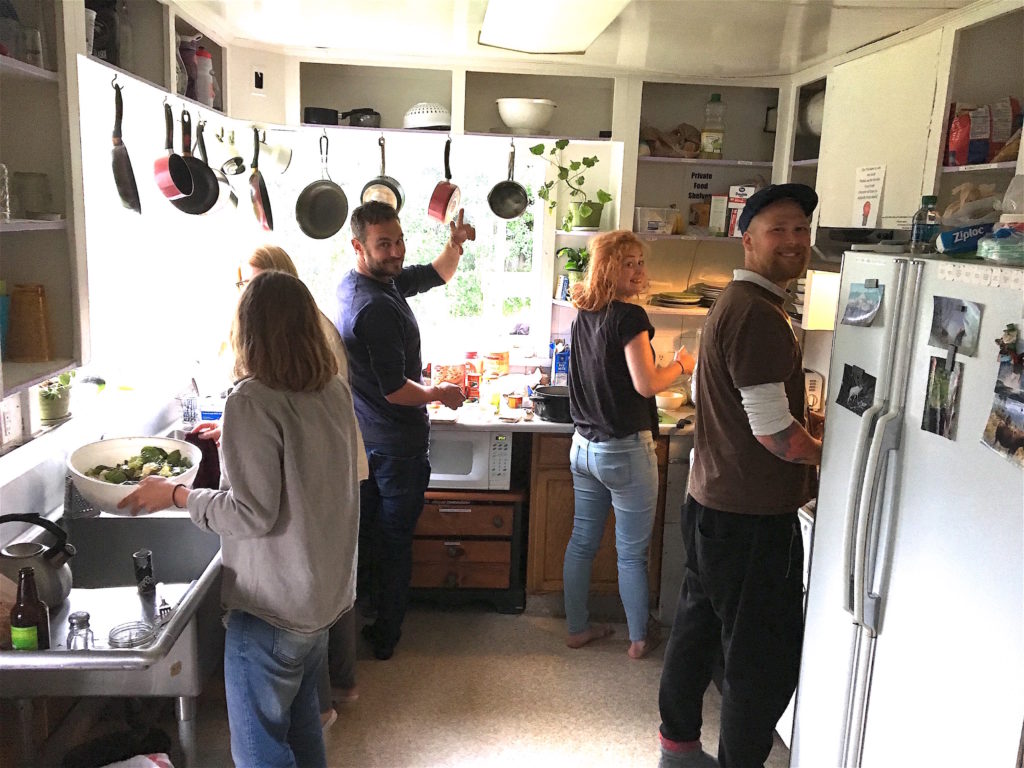 Guests cooking in our hostel kitchen